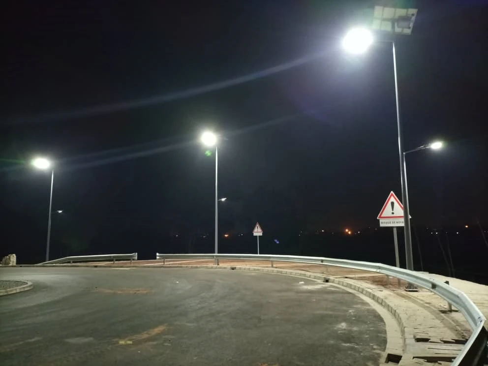 Solar street lights installed on a curved roadway at night Solar street lights installed on a curved roadway at night